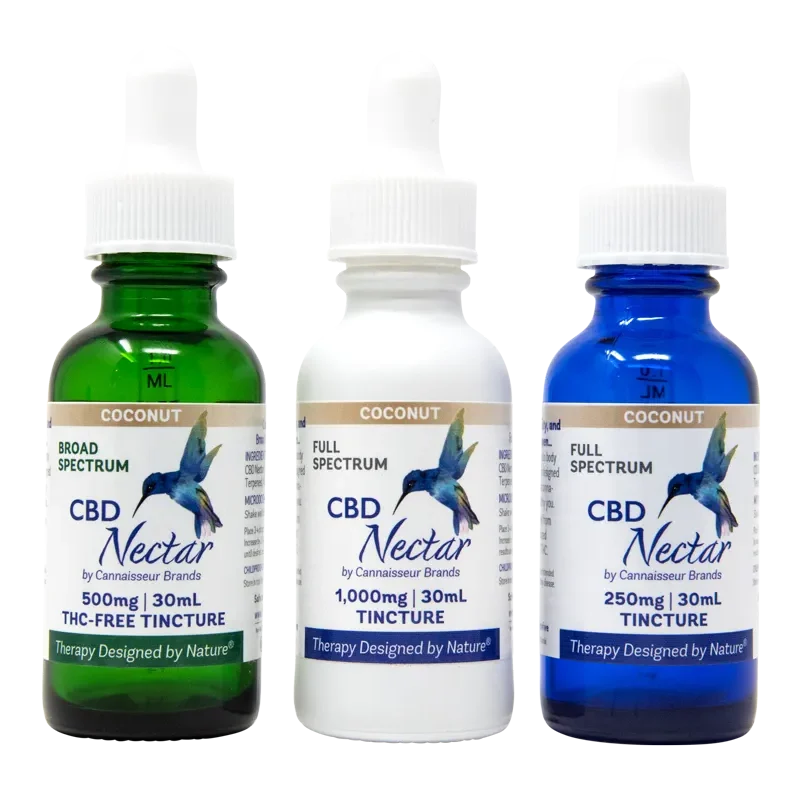 CBD oil tincture bottles in green, white, and bule.